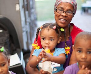 Woman holding toddler